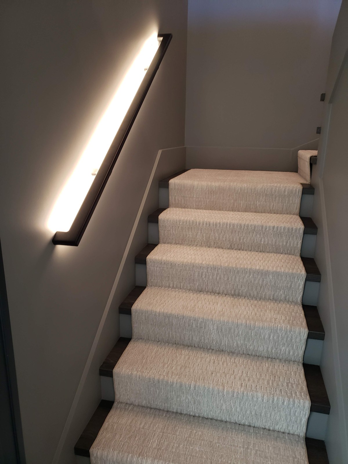 Architectural lighting integrated along a staircase in Hampstead